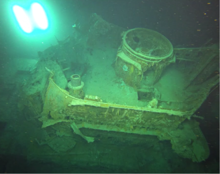 15-cm shell hole and the damage to HMAS Sydney’s  Direction Control Tower  base.